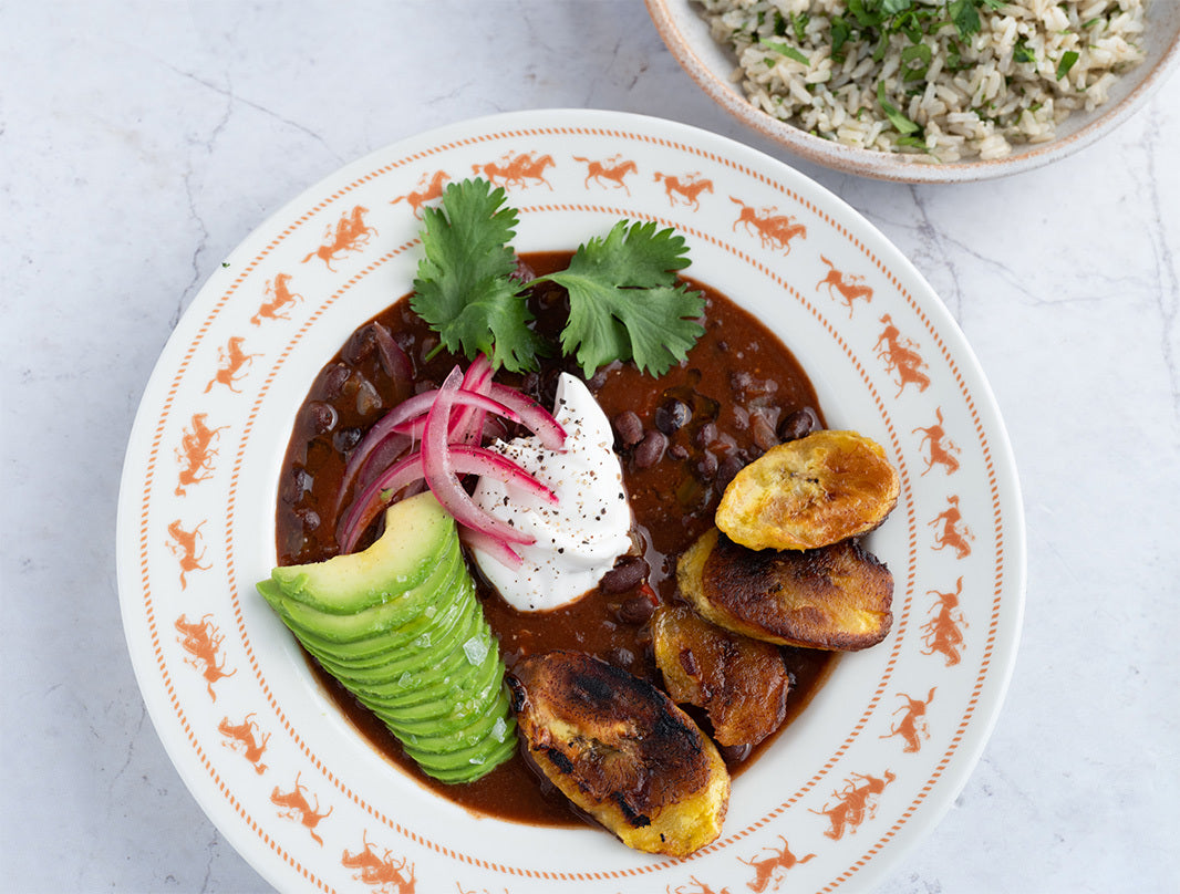 24 Plant Frijoles Negros With Caramelised Plantain, Whipped Feta, Pink Pickled Onions, Avocado & Coriander Lime Brown Rice