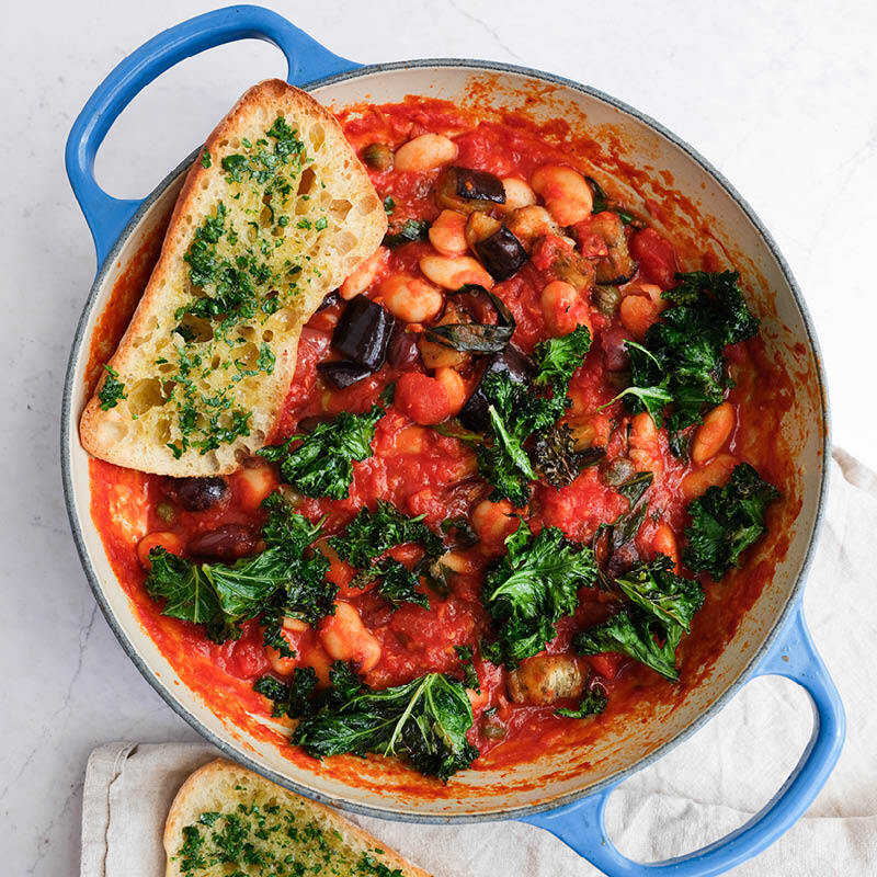 Butter Bean Puttanesca With Grilled Aubergine, Crispy Kale, Organic Garlic Ciabatta & Fresh Parsley