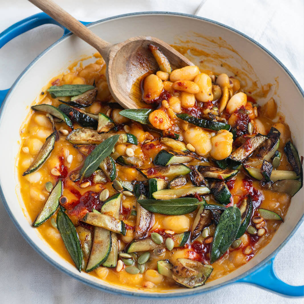 Butternut Squash Brothy Beans With Charred Courgette, Crispy Sage, Hot Agave 'Nduja' Dressing, Toasted Pine Nuts & Pumpkin Seeds