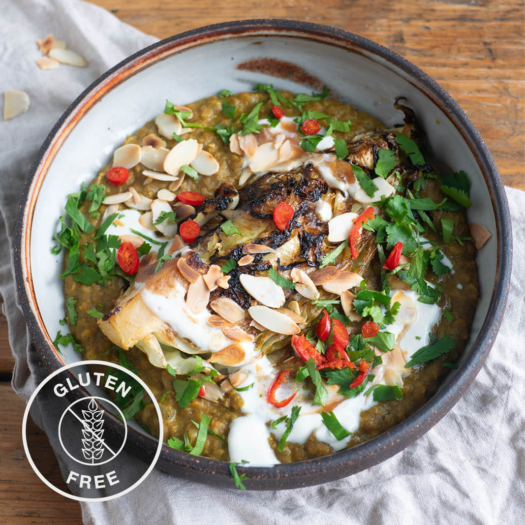 Charred Hispi Cabbage Over Golden Daal With Organic Soy Yoghurt, Tamarind & Date Chutney, Toasted Almonds & Coriander