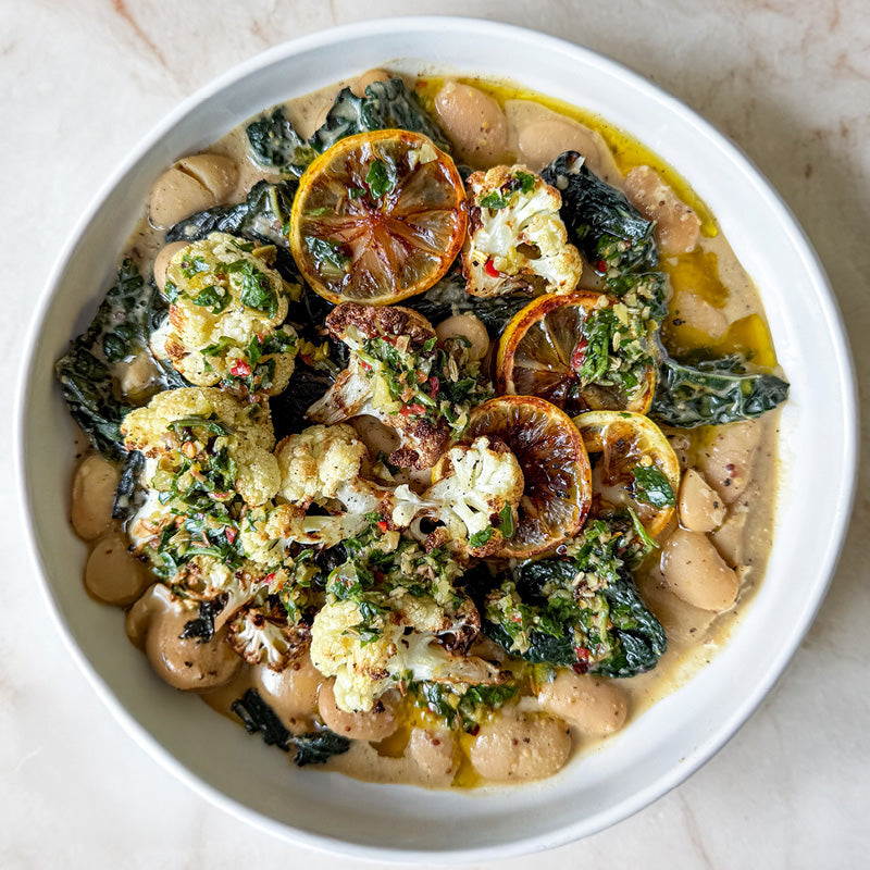 Creamy Butter Beans With Burnt Lemon & Mustard Sauce, Wilted Greens, Charred Cauliflower & Green Olive Salsa