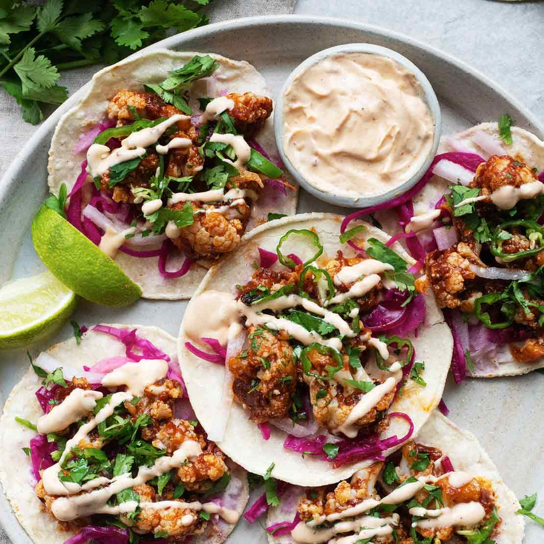Crispy Cauliflower Al Pastor Tacos With Jalapeño Salsa, Chipotle Cashew Crema, Pickled Cabbage & Lime