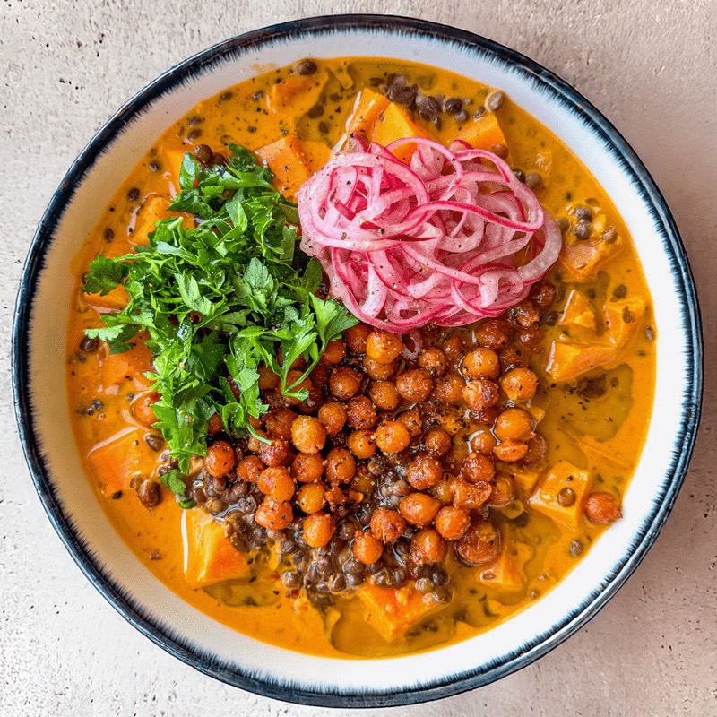 High Protein Thai Red Curry Lentil Soup With Sweet Potato, Smoky Crispy Chickpeas & Pink Onion Pickle