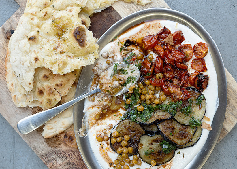 Hot 'Honey' Labneh Mezze With Smoky Grilled Aubergine, Roasted Cherry Tomatoes, Crispy Chickpeas & Freshly Baked Garlic Flatbread