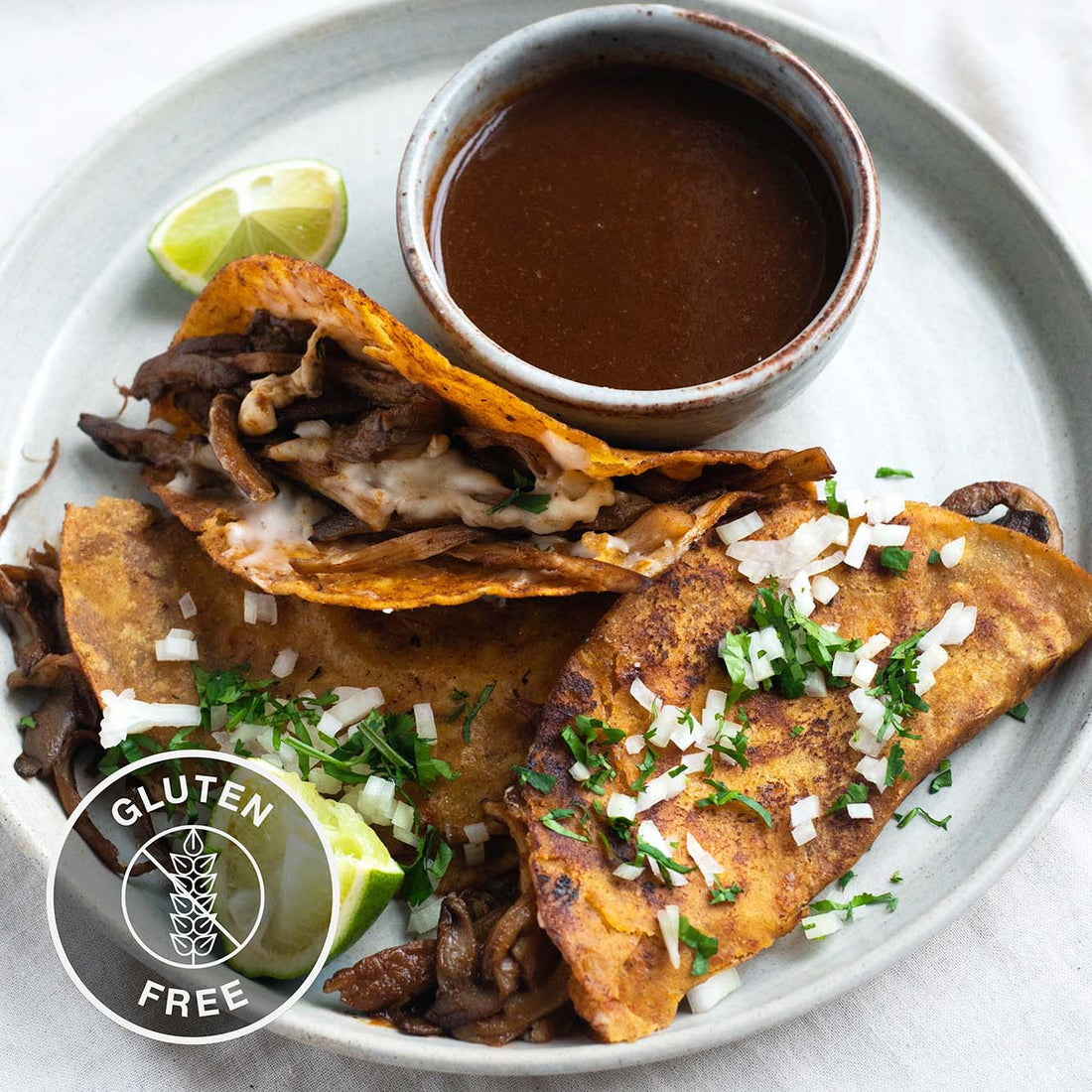 Mushroom Birria Tacos With Melted Vegan Mozzarella, Onion Salsa & Rich Dipping Consommé