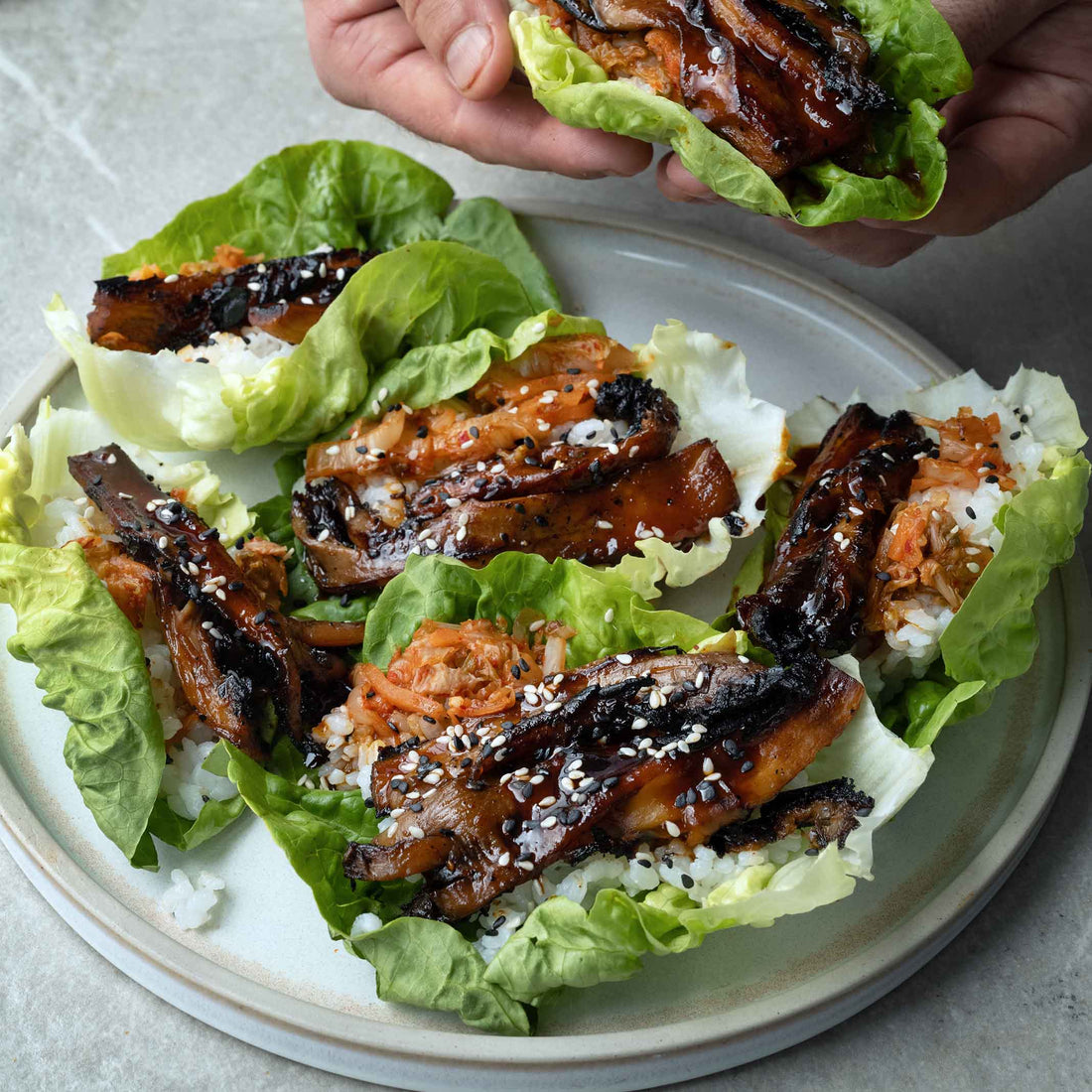Oyster Mushroom Bulgogi Skewers In Baby Gem Lettuce Wraps With Rice, Kimchi & Sesame Seeds