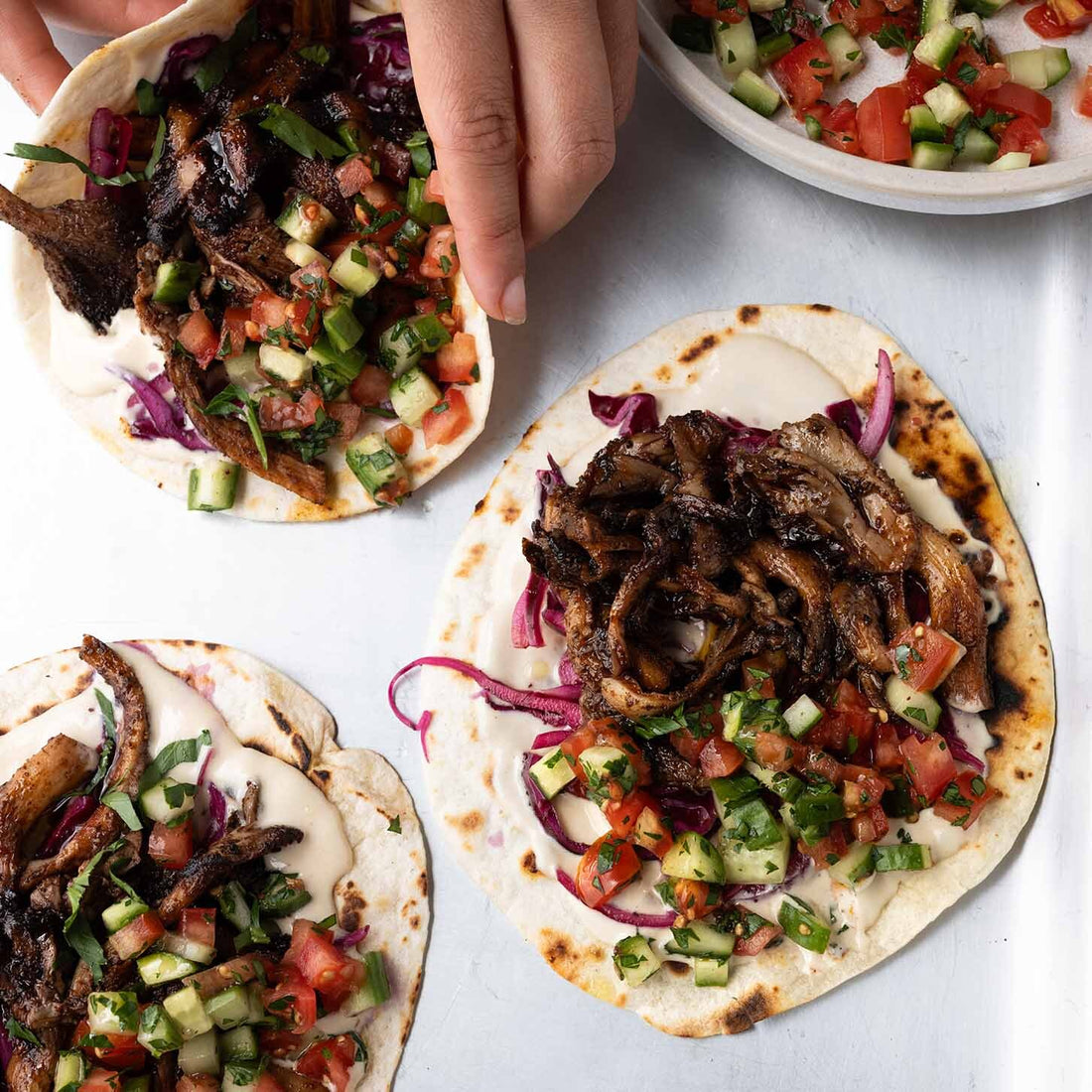 Oyster Mushroom Shawarma Tacos With Garlic Tahini Sauce, Chopped Shirazi Salad & Sumac Pickled Onions
