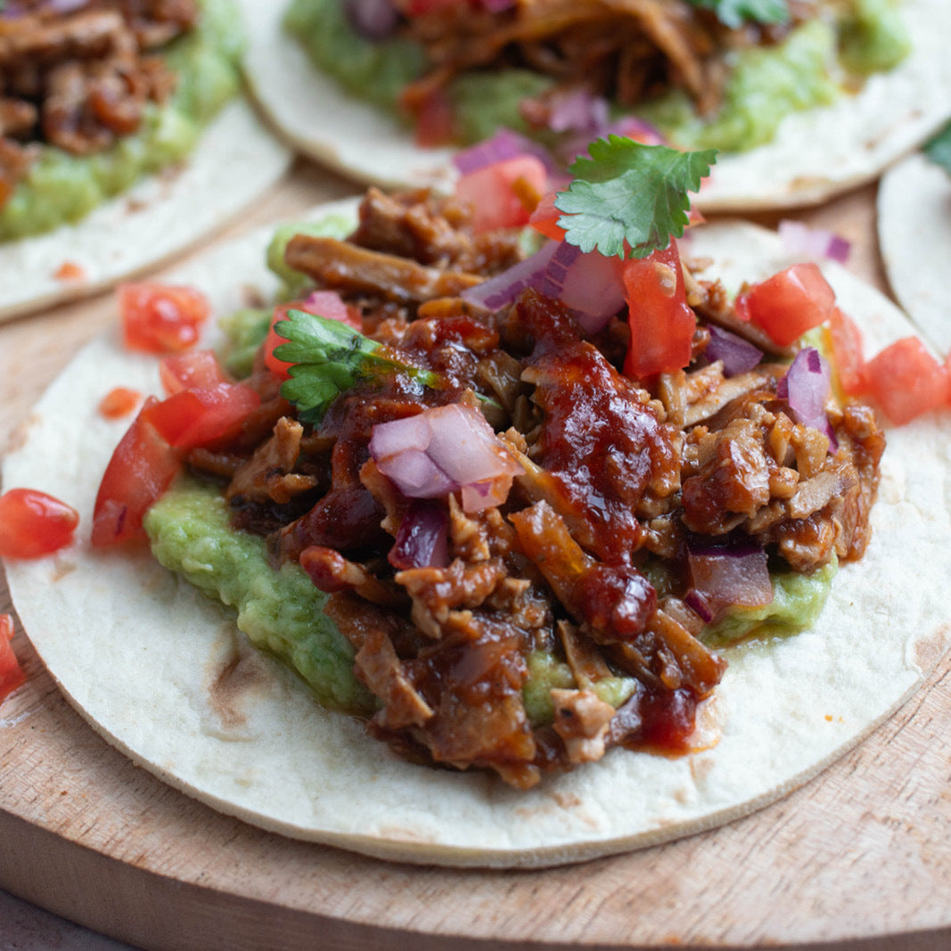 Pulled Tofu Tacos In Guajillo Adobo Sauce With Guacamole & Pico De Gallo On Soft Tortillas