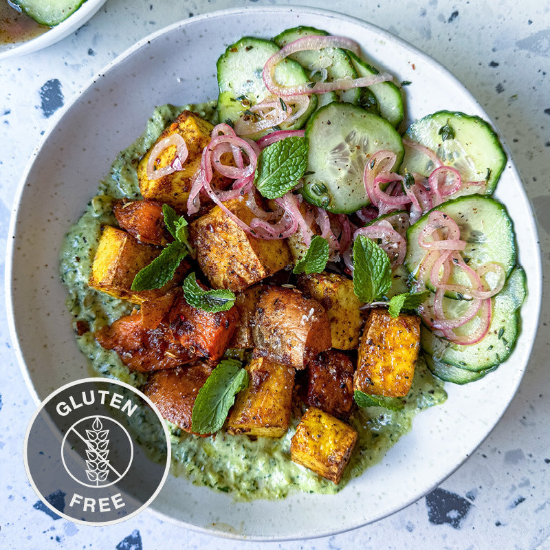 Ras El Hanout Sweet Potato & Tofu Bowl With Green Tahini & Sumac Onion Cucumber Salad
