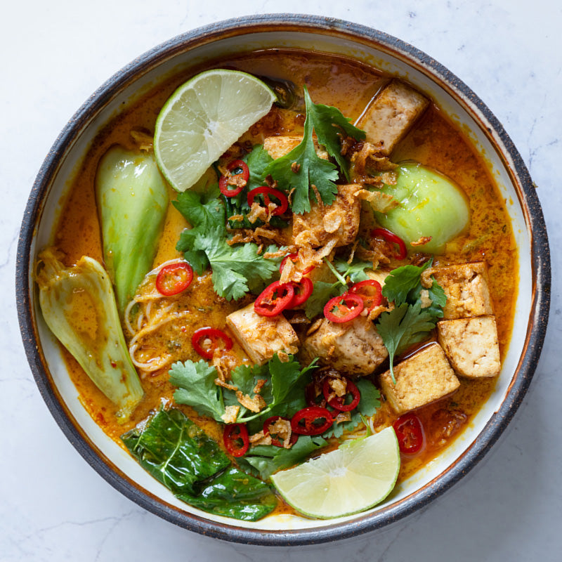 Rich & Fragrant Laksa With Tofu, Pak Choi, Vermicelli Noodles, Crispy Shallots, Chilli, Coriander & Lime