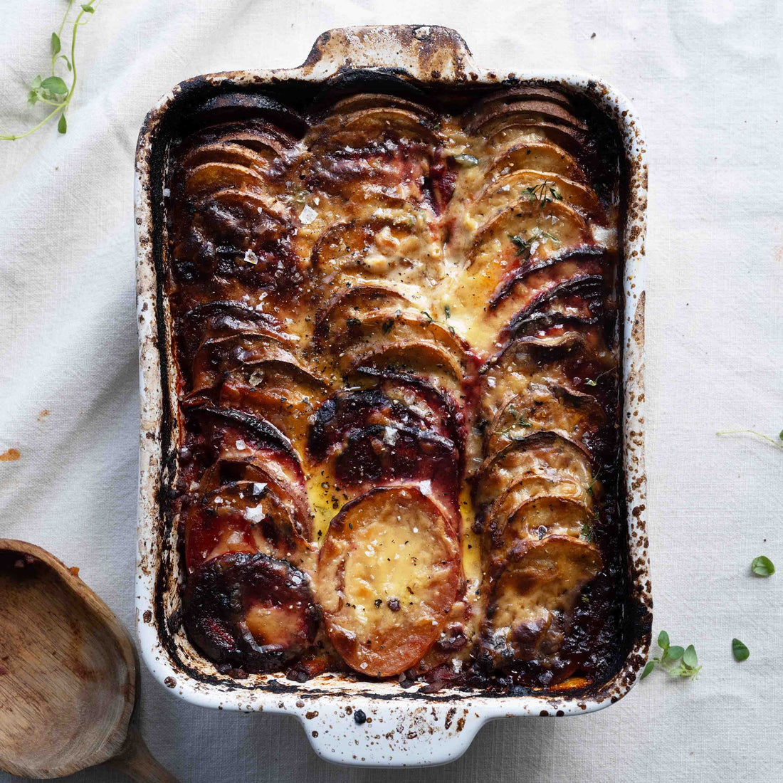Rich Ragu & Roasted Roots Gratin, Topped With Crispy Potato, Beetroot, Sweet Potato & Creamy Miso Bechamel