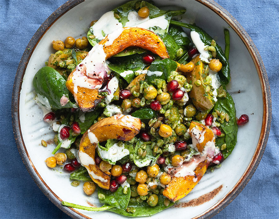 Super Green Grain Bowl With Roasted Squash, Crispy Chickpeas, Creamy Garlic Tahini & Pomegranate Seeds
