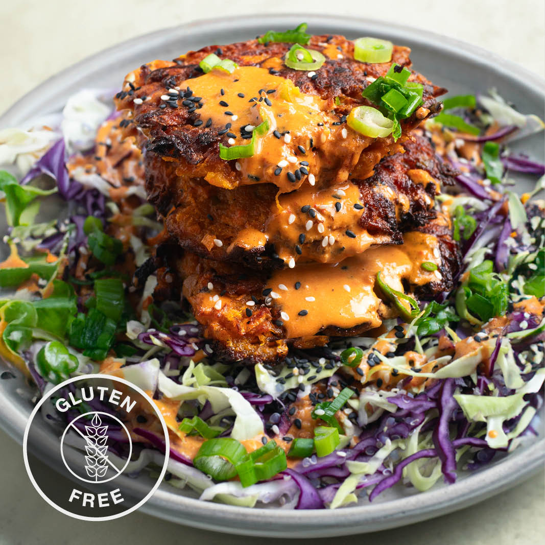 Thai Red Curry Sweet Potato Fritters Over Crunchy Mixed Veg & Quinoa Slaw With Aromatic Red Curry Dressing