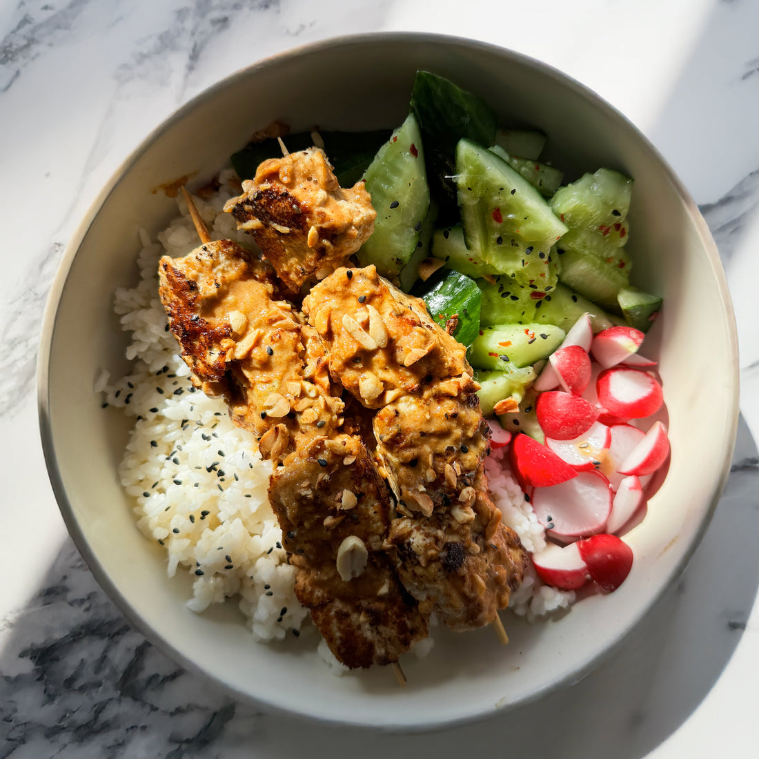 Tofu Satay Skewer Bowl With Zingy Smacked Cucumbers, Pink Radish, Sushi Rice & Sesame Peanut Garnish
