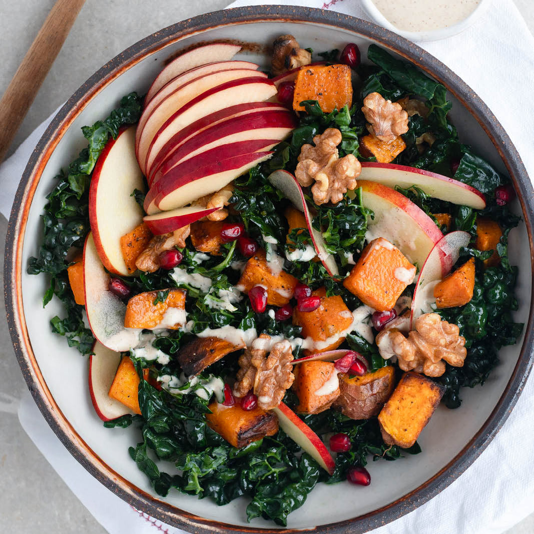 Winter Harvest Bowl With Roasted Sweet Potato, Candied Walnuts & Maple Tahini Dressing